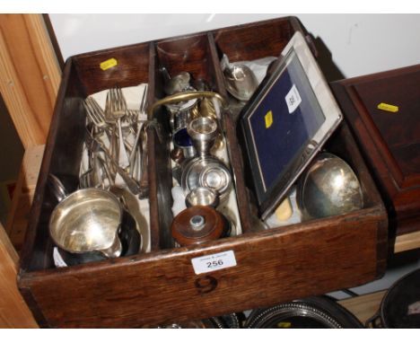 A 19th Century oak cutlery tray with carrying handle and a quantity of assorted silver plated flatware, candlesticks, etc