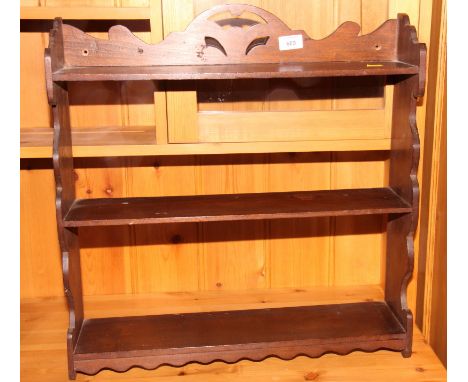 A 19th Century three-tier wall shelf, 22" wide
