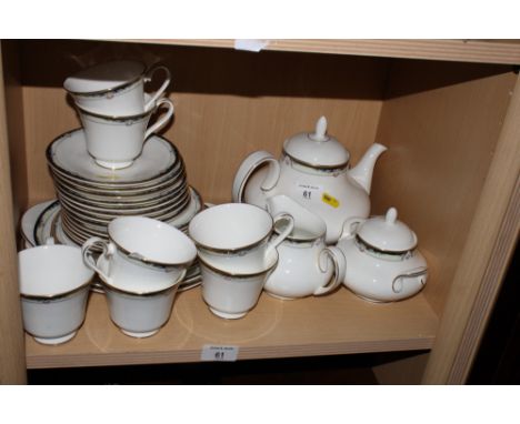 A Doulton "Rhodes" pattern part tea service, twenty-eight pieces approx, sixteen Doulton "Louvre" dinner plates and two match