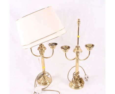 A pair of brass two-light table lamps with oval shades