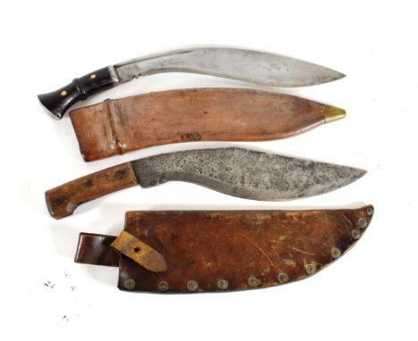 A Second World War British Military Issue Kukri, the the 34cm heavy curved steel blade stamped M.1.41, with a narrow fuller t
