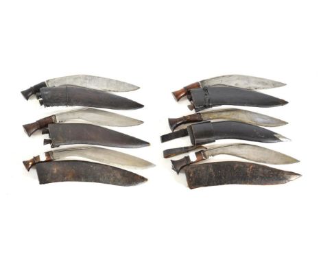 A Second World War Nepalese 'Budhume' Kukri, the 37cm broad curved steel blade with two narrow fullers to the back edge, with