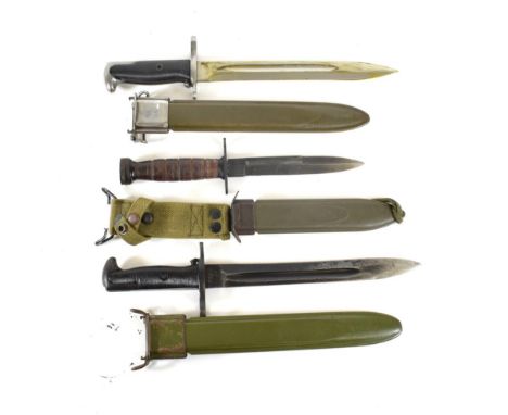 Two US M1 Garand Knife Bayonets, one with 24.5cm blued steel blade, the other with 25cm steel blade, each stamped with maker'