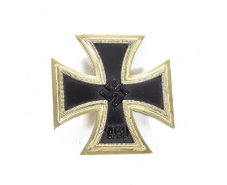 A German Third Reich Iron Cross, first class, with vertical sword shape pin
