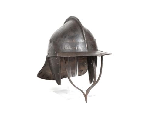 A 17th Century Civil War Harquebusier's Lobster Tail Helmet, the skull made from two pieces joined by a raised comb running f