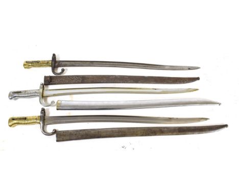 Three French M1866 Chassepot Yataghan Sword Bayonets, one with chromed finish to the hilt, blade and scabbard, two with brass