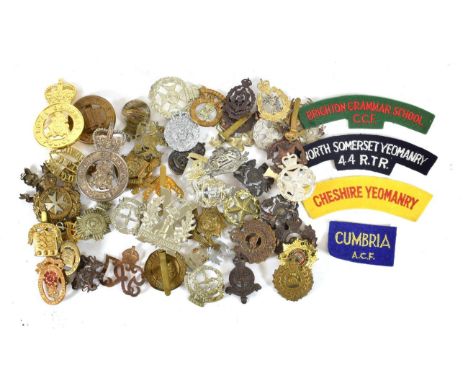 A Collection of Eighty Various Military Badges, including cap, glengarry, helmet plates and shoulder titles; also, four embro