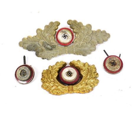 A Third Reich NSDAP Political Leader's Visor Cap Oak Leaf Insignia, of stamped heavy gauge gilt metal encompassing a three pi