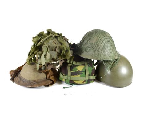 Five British Army Helmets, including a Second World War Brodie helmet by J.C.S.&amp; W.Ltd, dated 1939, with waterproof neck 