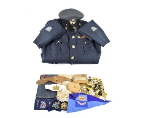 An Elizabeth RAF Uniform to a Warrant Officer, comprising service tunic with staybrite buttons, sleeve rank insignia and meda