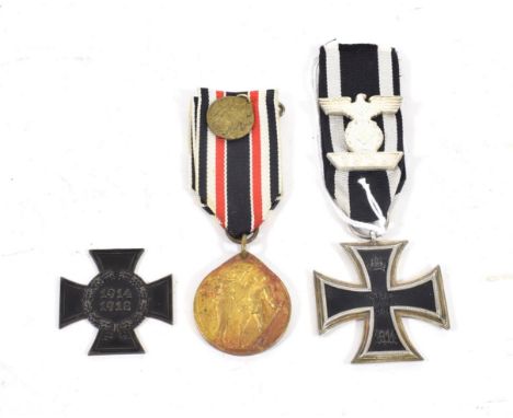 An Imperial German Iron Cross, Second Class, with 1939 Spange, the medal of three piece construction, the suspender ring stam