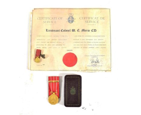 A Canadian Forces Decoration (E.II.R.), with additional ten year service bar and miniature, awarded to F/L W.E.MORSE, in orig