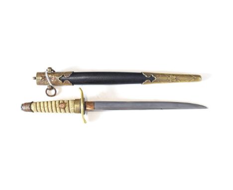 A Japanese Model 1883 Naval Dirk, the 22cm single edge steel blade with a narrow fuller to the back edge, with one piece copp