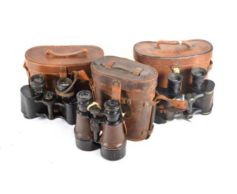 Three Pairs of First World War British Binoculars:- prismatic x 6, by Dollond, London, marked with broad arrow, numbered 18, 