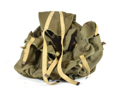 A Second World War Commando Bergen Rucksack, in olive green heavy duty canvas, with external metal A frame, webbing straps, e