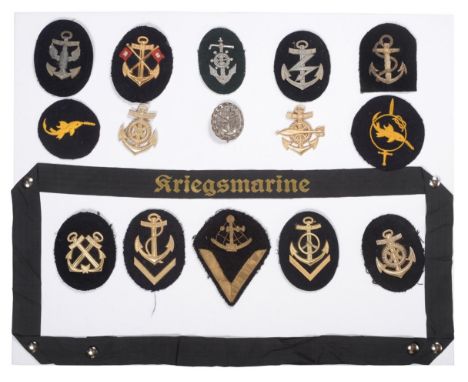A Collection of Fourteen German Third Reich Kriegsmarine Trade, Proficiency and Rank Badges, including a Kriegsmarine cap tal
