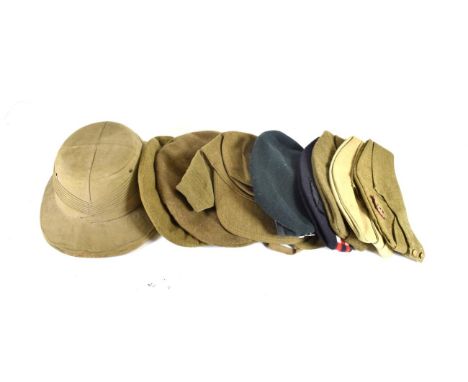 A Collection of Ten Pieces of British Military Headgear, comprising a pith helmet by Cecil &amp; Co., Calcutta; a tam o'shant