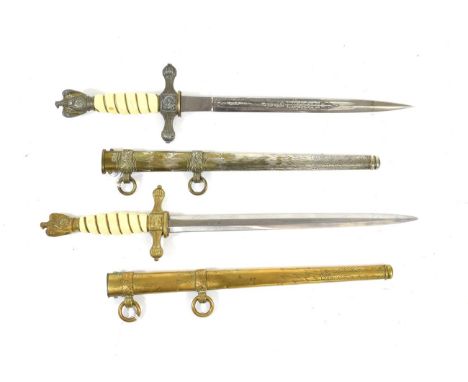 A German Third Reich Naval Dirk, the 25cm double edge steel blade with two narrow fullers to each side, etched with fouled an