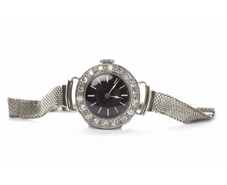 LADY'S ROLEX PRIMA DIAMOND COCKTAIL WATCHSigned Rolex Prima, sixteen jewels manual wind movement, the black dial with white b