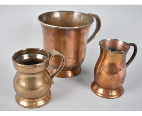 A Collection of Three Vintage Metal Measures 