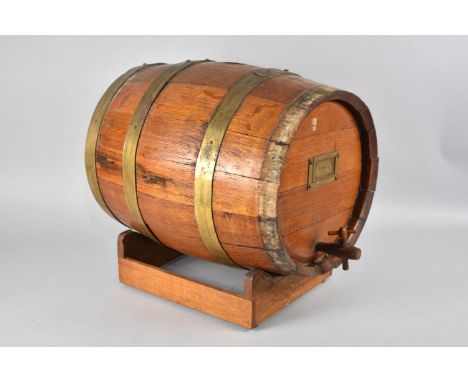A Vintage Brass Bound Oak Coopered Oloroso Sherry Barrel on Stand, Wooden Tap, Missing One Brass Ring, 41cms Long 