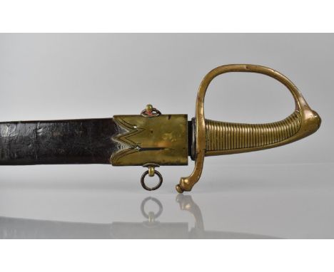 A French 1819 Pattern Briquet Short Sword having Ribbed Brass Grip and Slightly Curved Blade. Brass Mounted Leather Scabbard 