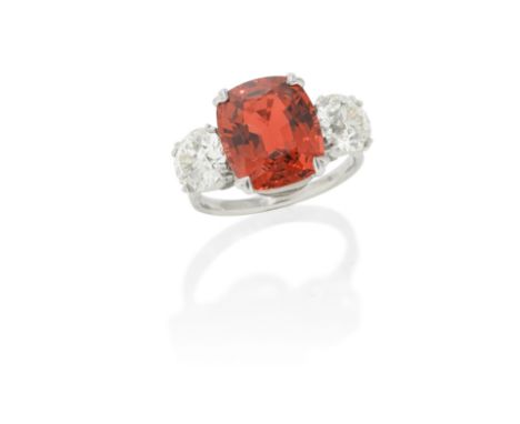 SPINEL AND DIAMOND RINGThe cushion-shaped spinel, weighing 6.28 carats, between two old brilliant-cut diamonds, weighing 1.18