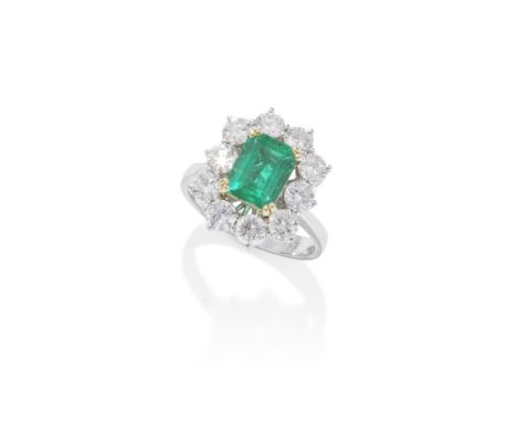 EMERALD AND DIAMOND RINGThe step-cut emerald, weighing 1.82 carats, within a brilliant-cut diamond surround, ring size PFootn