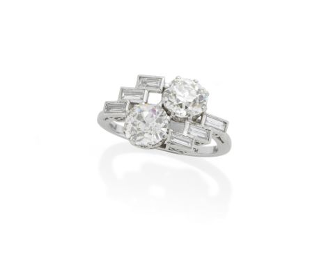 DIAMOND TWO-STONE RINGThe two old brilliant-cut diamonds, each weighing 2.02 carats, between baguette-cut diamond shoulders, 