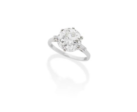 DIAMOND SINGLE-STONE RINGThe cushion-shaped diamond, weighing 5.18 carats, between baguette-cut diamond shoulders, ring size 