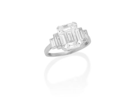 DIAMOND RINGThe step-cut diamond, weighing 4.76 carats, between stepped baguette-cut diamonds, ring size OFootnotes:Accompani
