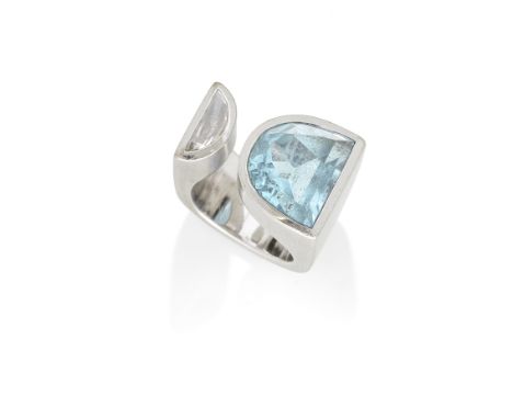 GRIMA: TOPAZ AND DIAMOND RINGThe brushed geometric band issuing a demi-lune shaped topaz and similarly-shaped diamond, signed