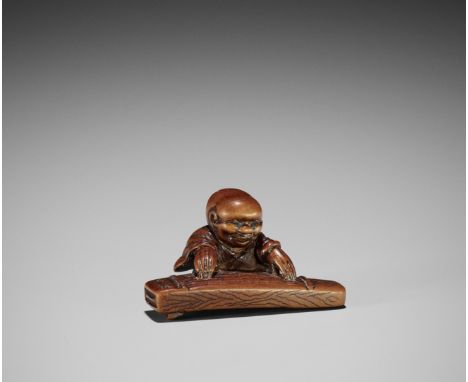 MASAKAZU: A RARE WOOD NETSUKE OF A BAKEMONO PLAYING THE KOTOBy Masakazu, signed MasakazuJapan, Osaka, 19th century, Edo perio