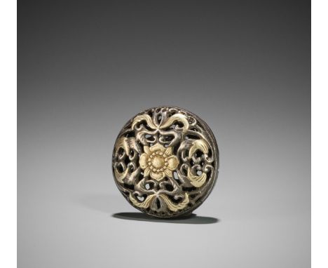 A RARE SILVER AND GILT RYUSA MANJU NETSUKEJapan, 18th century, Edo period (1615-1868)The massively cast and open-worked silve