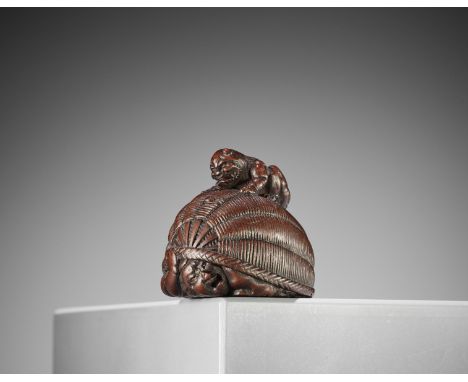MASAKAZU: A SUPERB WOOD NETSUKE OF AN ONI TRAPPING SHOKIBy Masakazu, signed MasakazuJapan, Gifu/Nagoya, mid-19th century, Edo