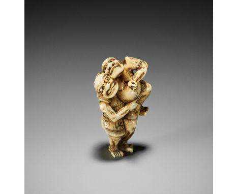 AN IVORY NETSUKE OF TWO SUMO WRESTLERSJapan, Osaka, early 19th century, Edo period (1615-1868)Boldly carved to depict two wre