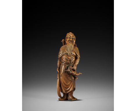 A TALL WOOD NETSUKE OF SHOKI AND ONIJapan, Meiji period (1615-1868)Well carved standing, holding a small helpless oni by the 