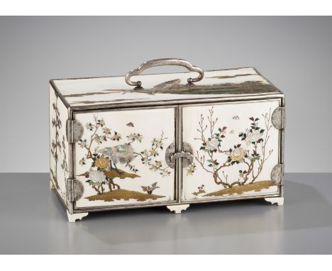 A SUPERB AND LARGE SHIBAYAMA-INLAID SILVER AND IVORY CABINETJapan, Meiji period (1868-1912)Of rectangular form, standing on s