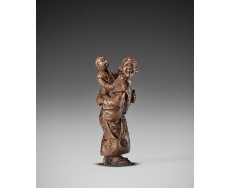 MASATSUGU: A FINE WOOD NETSUKE OF A SARUMAWASHIBy Masatsugu, signed Masatsugu Japan, late 19th centuryAn unusually charming a