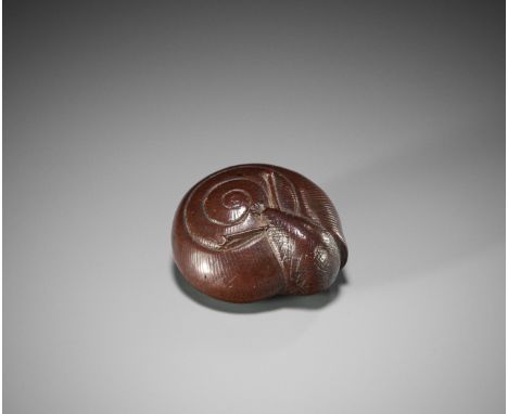 MINSHO: A WOOD NETSUKE OF A SNAILBy Minsho, signed MinshoJapan, 19th century, Edo period (1615-1868)Well carved as a snail em