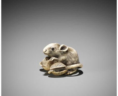 AN IVORY NETSUKE OF A RAT WITH HAMAGURI CLAMSJapan, Osaka or Kyoto, 18th century, Edo period (1615-1868)A well-sized and bold