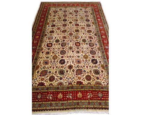 Large hand knotted Tabriz carpet, ivory field with multicoloured foliage within multistripe repeating border, 600cm x 380cm  