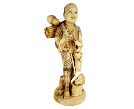 Meji period Japanese sectional ivory okimono of a woodcutter, he stands with bundle of faggots and a gourd on his back carryi