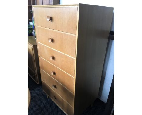 A meadow light oak chest of six long drawers.