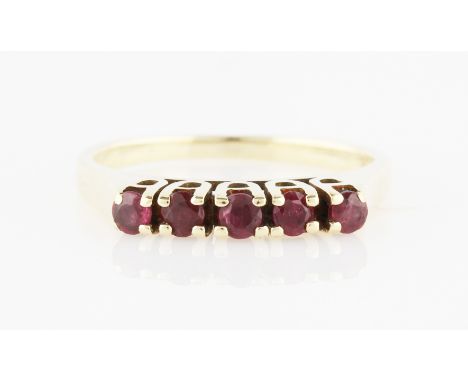 A five stone ruby ring, set with five round cut rubies, yellow metal stamped 585, ring size K.