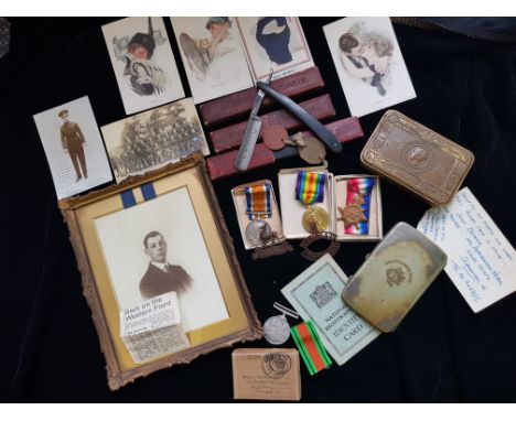 Three W.W.1 medals J.Deakin with various post cards, 1914 Christmas box Royal Warwickshire regiment cigarette box, cuttings, 