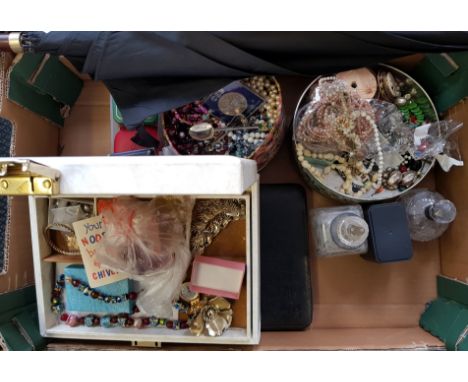 A collection of various beads, a hallmarked silver enamel spoon, wrist watches, commemorative coins, perfume bottles, boxed h