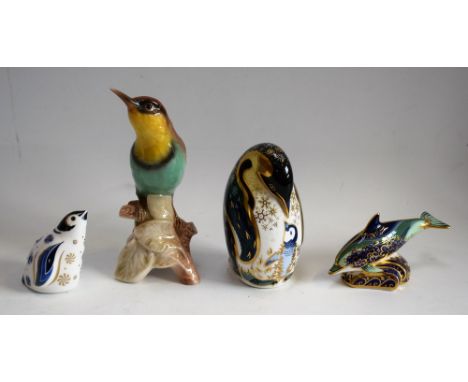 A Royal Crown Derby paperweight, Penguin and Chick, gold stopper; another, Baby Bottlenose Dolphin, gold stopper; a Collector