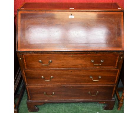 An Edwardian crossbanded mahogany bureau, fall front enclosing an arrangement of small drawers, pigeon holes and a central do