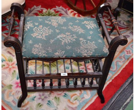 An early 20th century piano stool, galleried rack, upholstered seat 
